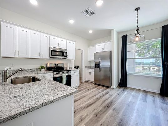 Interior, Kitchen, Pendant Lights, Recessed Lighting, Stainless Steel Appliances, Wood Texture Flooring