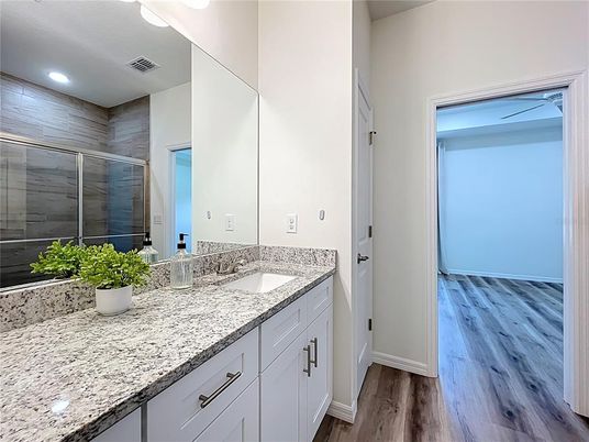 Bathroom, Dual Sink Vanities, Interior, Recessed Lighting, Wood Texture Flooring
