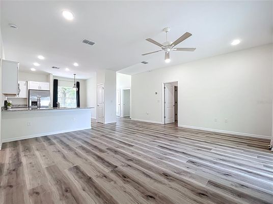 Empty room, Interior, Kitchen, Pendant Lights, Recessed Lighting, Stainless Steel Appliances, Wood Texture Flooring
