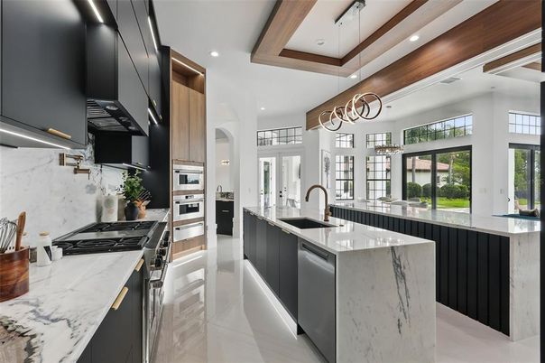 Interior, Kitchen, Marble Walls, Pendant Lights, Recessed Lighting, Stainless Steel Appliances