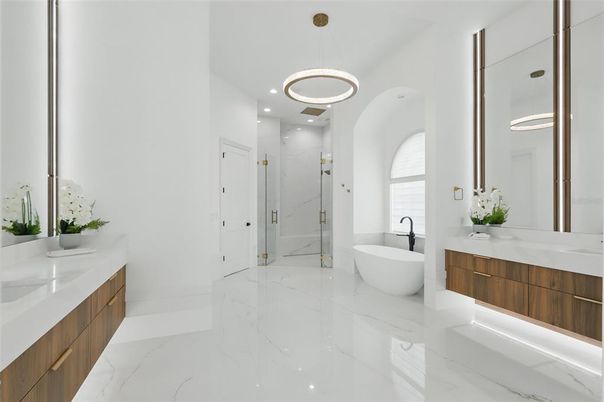 Bathroom, Dual Sink Vanities, Free Standing Baths, Glass Shower, Interior, Marble, Marble Walls, Pendant Lights, Recessed Lighting