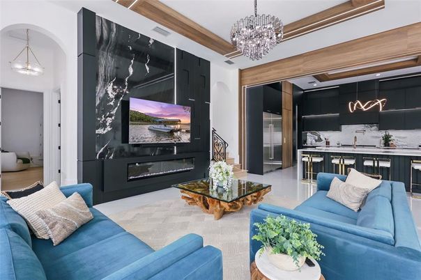 Chandelier, Fireplace, Interior, Kitchen, Living room, Pendant Lights, Stainless Steel Appliances