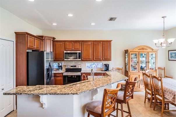 Chandelier, Dining room, Interior, Kitchen, Recessed Lighting, Stainless Steel Appliances