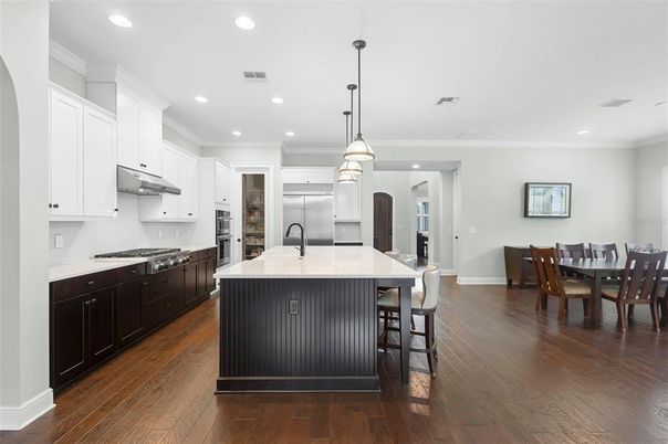 Dining room, Interior, Kitchen, Pendant Lights, Recessed Lighting, Stainless Steel Appliances, Wood Texture Flooring
