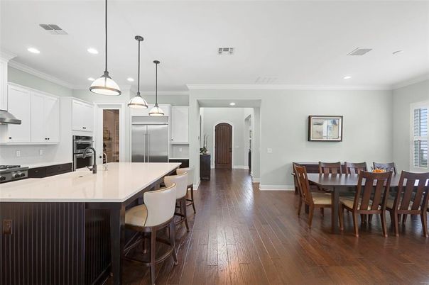 Dining room, Interior, Kitchen, Pendant Lights, Recessed Lighting, Stainless Steel Appliances, Wood Texture Flooring