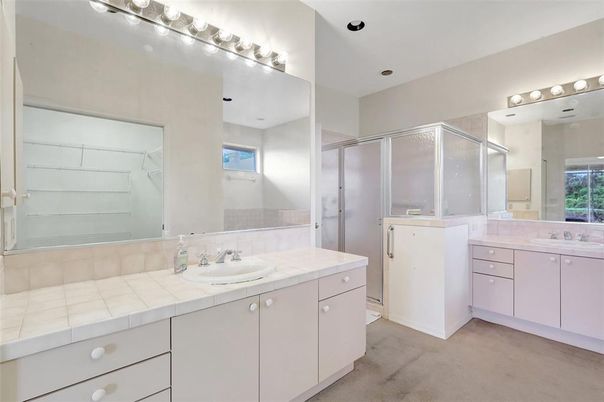Bathroom, Dual Sink Vanities, Glass Shower, Interior, Recessed Lighting, Tile Countertops