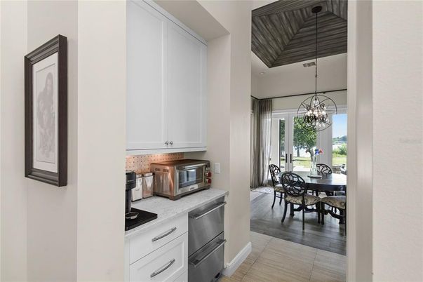 Chandelier, Dining room, Interior, Kitchen, Pendant Lights, Stainless Steel Appliances, Wood Texture Flooring