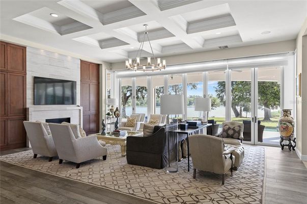 Chandelier, Fireplace, Interior, Living room, Recessed Lighting, Wood Texture Flooring