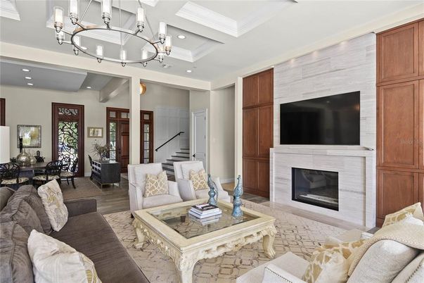 Chandelier, Dining room, Fireplace, Interior, Living room, Recessed Lighting, Wood Texture Flooring
