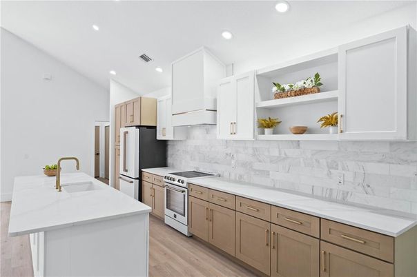 Interior, Kitchen, Marble Walls, Recessed Lighting, Stainless Steel Appliances, Wood Texture Flooring