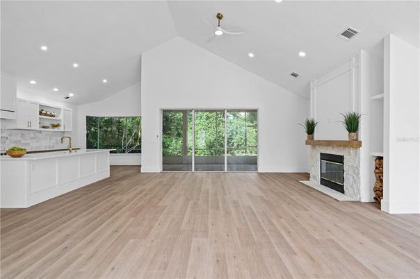 Empty room, Fireplace, Interior, Kitchen, Recessed Lighting, Wood Texture Flooring