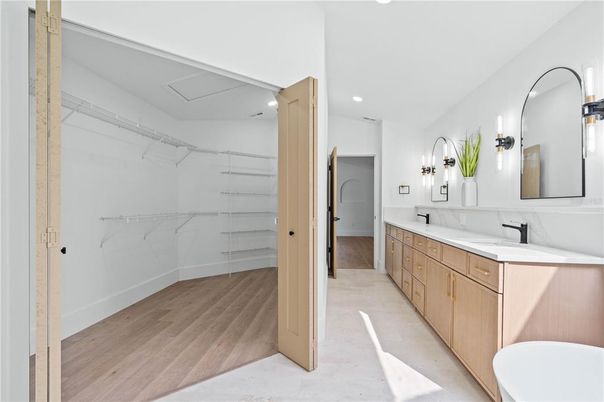 Bathroom, Dual Sink Vanities, Interior, Recessed Lighting, Walk-in Closets, Wood Texture Flooring