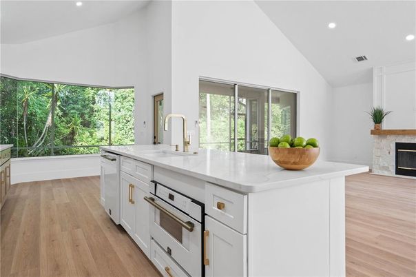 Fireplace, Interior, Kitchen, Recessed Lighting, Stainless Steel Appliances, Wood Texture Flooring