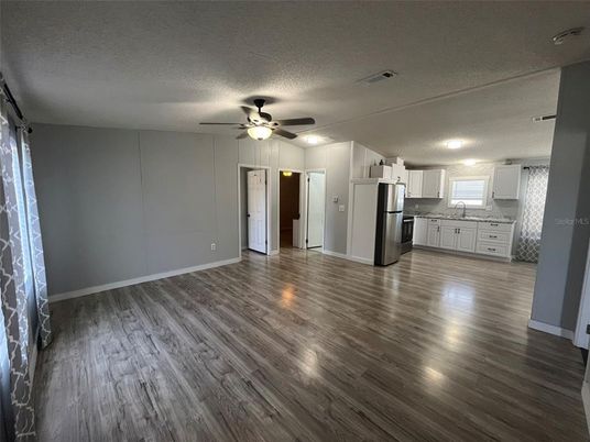 Empty room, Interior, Kitchen, Stainless Steel Appliances, Wood Texture Flooring