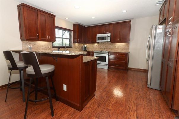 Interior, Kitchen, Recessed Lighting, Stainless Steel Appliances, Wood Texture Flooring