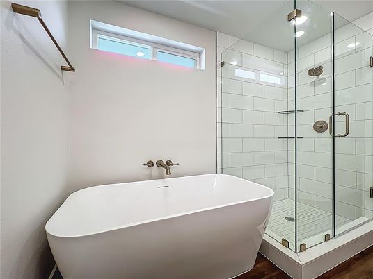 Bathroom, Free Standing Baths, Glass Shower, Interior, Recessed Lighting, Wood Texture Flooring