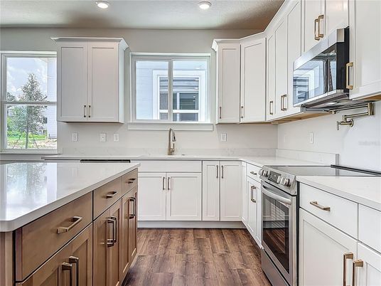 Interior, Kitchen, Recessed Lighting, Stainless Steel Appliances, Wood Texture Flooring