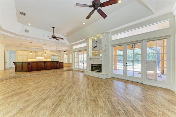 Empty room, Fireplace, Interior, Kitchen, Pendant Lights, Recessed Lighting, Wood Texture Flooring