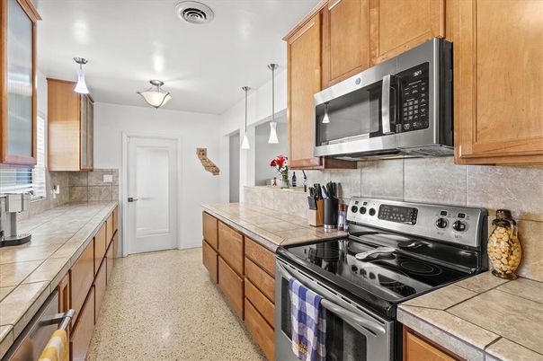 Interior, Kitchen, Pendant Lights, Stainless Steel Appliances, Tile Countertops
