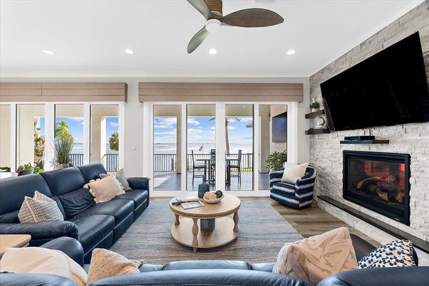 Fireplace, Interior, Living room, Recessed Lighting, Stone Walls, Water, Wood Texture Flooring