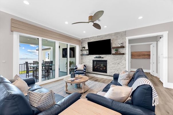 Fireplace, Interior, Living room, Recessed Lighting, Stone Walls, Wood Texture Flooring
