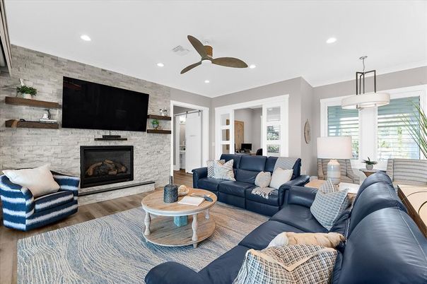 Fireplace, Interior, Living room, Recessed Lighting, Stone Walls, Wood Texture Flooring