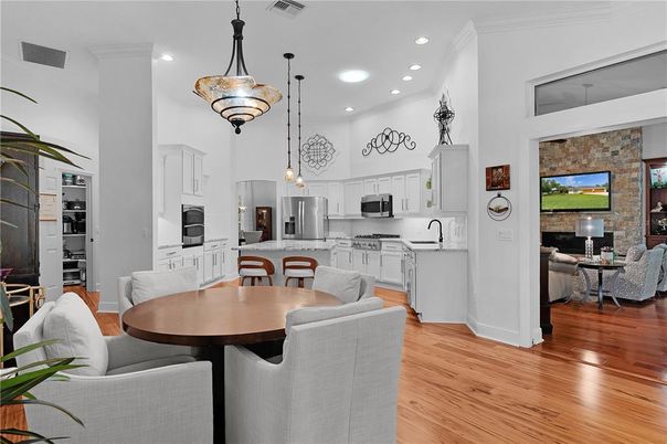 Dining room, Fireplace, Interior, Kitchen, Living room, Pendant Lights, Recessed Lighting, Stainless Steel Appliances, Stone Walls, Wood Texture Flooring