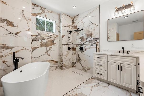Bathroom, Dual Sink Vanities, Free Standing Baths, Interior, Marble, Marble Walls, Recessed Lighting