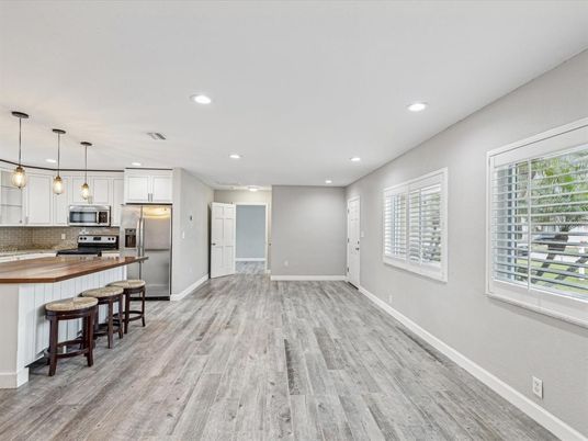 Interior, Kitchen, Pendant Lights, Recessed Lighting, Stainless Steel Appliances, Wood Texture Flooring