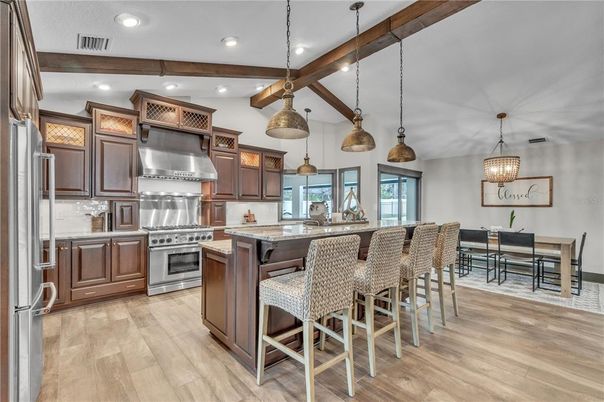 Dining room, Interior, Kitchen, Pendant Lights, Recessed Lighting, Stainless Steel Appliances, Wooden Beams, Wood Texture Flooring