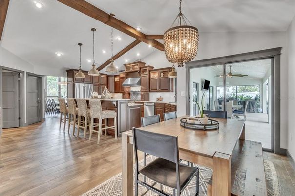 Chandelier, Dining room, Interior, Kitchen, Pendant Lights, Recessed Lighting, Stainless Steel Appliances, Wooden Beams, Wood Texture Flooring