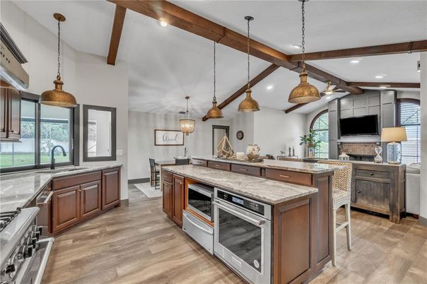 Fireplace, Interior, Kitchen, Pendant Lights, Recessed Lighting, Stainless Steel Appliances, Wooden Beams, Wood Texture Flooring