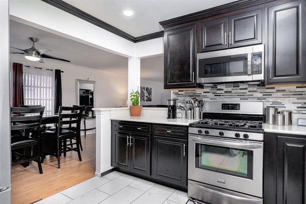 Dining room, Interior, Kitchen, Recessed Lighting, Stainless Steel Appliances, Wood Texture Flooring