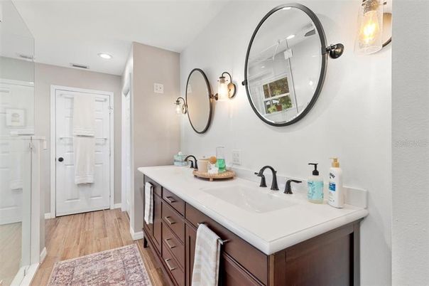 Bathroom, Dual Sink Vanities, Interior, Recessed Lighting, Wood Texture Flooring