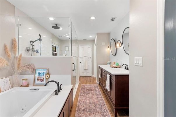 Bathroom, Dual Sink Vanities, Glass Shower, Interior, Recessed Lighting, Wood Texture Flooring