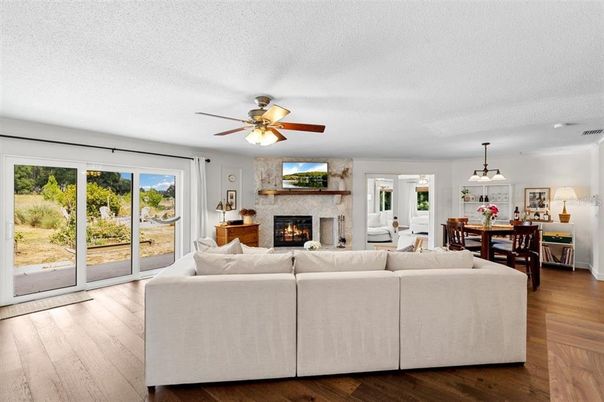 Dining room, Fireplace, Interior, Living room, Pendant Lights, Wood Texture Flooring