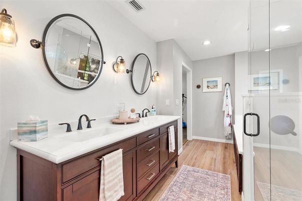 Bathroom, Dual Sink Vanities, Glass Shower, Interior, Recessed Lighting, Wood Texture Flooring