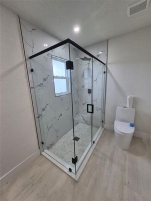 Bathroom, Glass Shower, Interior, Marble Walls, Recessed Lighting, Wood Texture Flooring