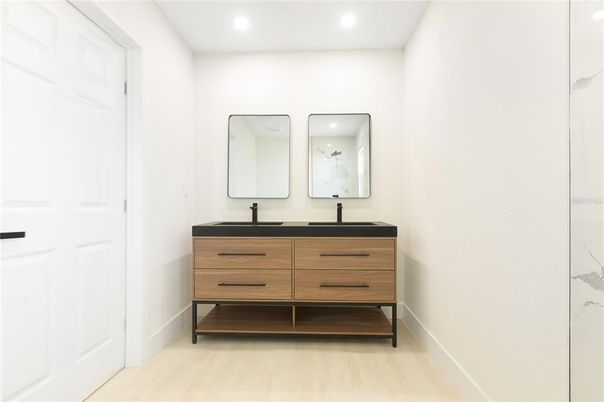 Bathroom, Dual Sink Vanities, Interior, Recessed Lighting, Wood Texture Flooring