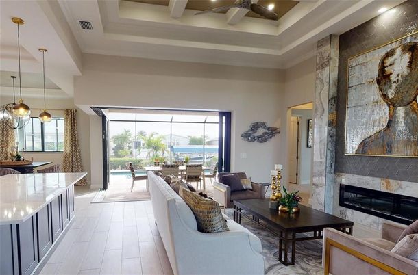 Fireplace, Interior, Living room, Pendant Lights, Recessed Lighting, Water, Wood Texture Flooring