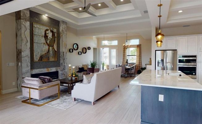 Chandelier, Dining room, Fireplace, Interior, Kitchen, Living room, Pendant Lights, Recessed Lighting, Stainless Steel Appliances, Wood Texture Flooring