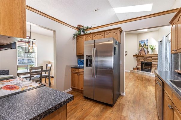 Dining room, Fireplace, Interior, Kitchen, Pendant Lights, Recessed Lighting, Wood Texture Flooring