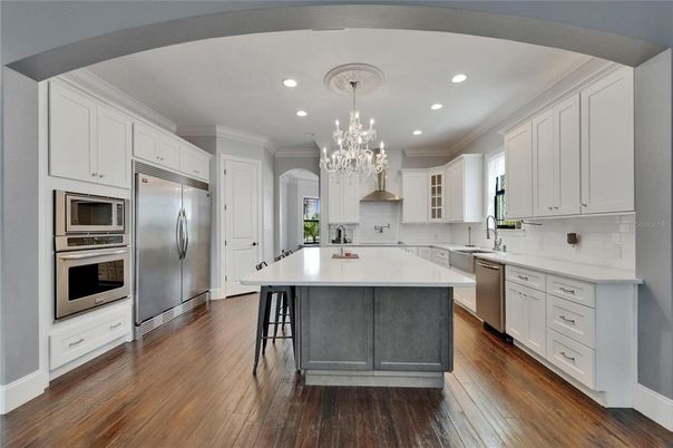 Chandelier, Interior, Kitchen, Recessed Lighting, Stainless Steel Appliances, Wood Texture Flooring