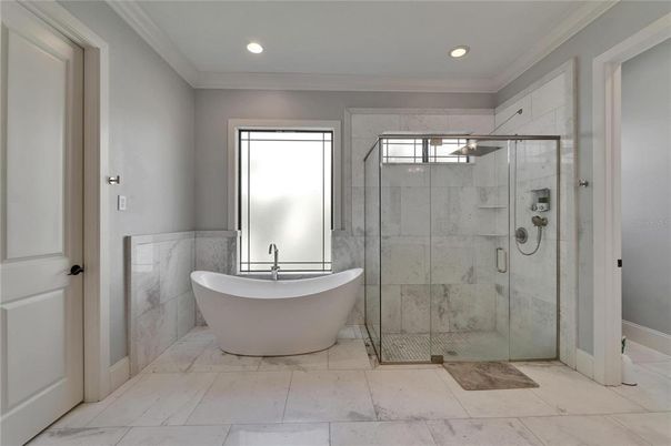 Bathroom, Free Standing Baths, Glass Shower, Interior, Marble Walls, Recessed Lighting