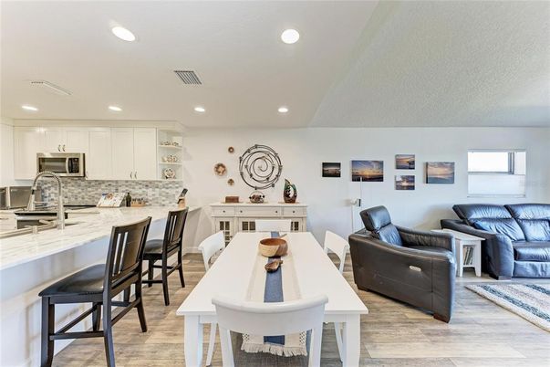 Dining room, Interior, Kitchen, Living room, Recessed Lighting, Stainless Steel Appliances, Wood Texture Flooring