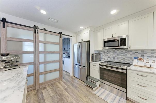 Interior, Kitchen, Recessed Lighting, Stainless Steel Appliances, Wood Texture Flooring