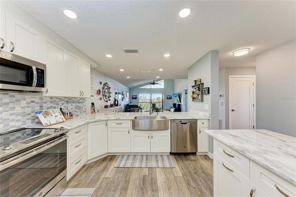 Interior, Kitchen, Recessed Lighting, Stainless Steel Appliances, Wood Texture Flooring