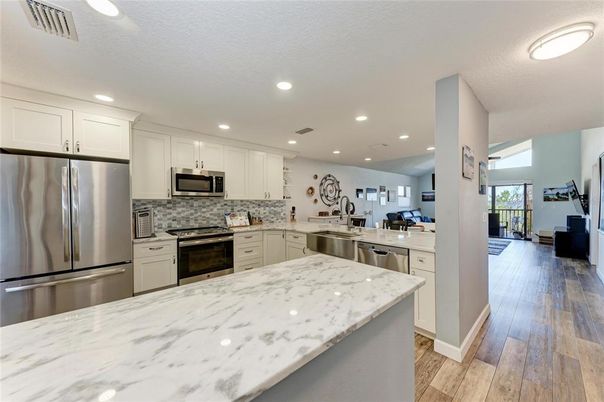 Interior, Kitchen, Recessed Lighting, Stainless Steel Appliances, Wood Texture Flooring