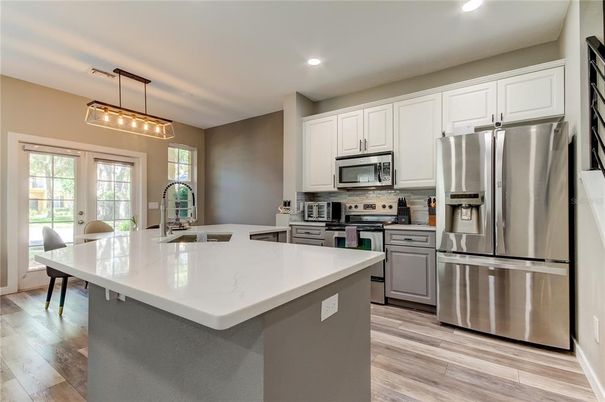 Interior, Kitchen, Pendant Lights, Recessed Lighting, Stainless Steel Appliances, Wood Texture Flooring
