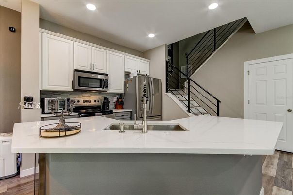 Interior, Kitchen, Recessed Lighting, Stainless Steel Appliances, Wood Texture Flooring